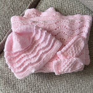 Light pink handmade blanket, hat, and mittens gift set